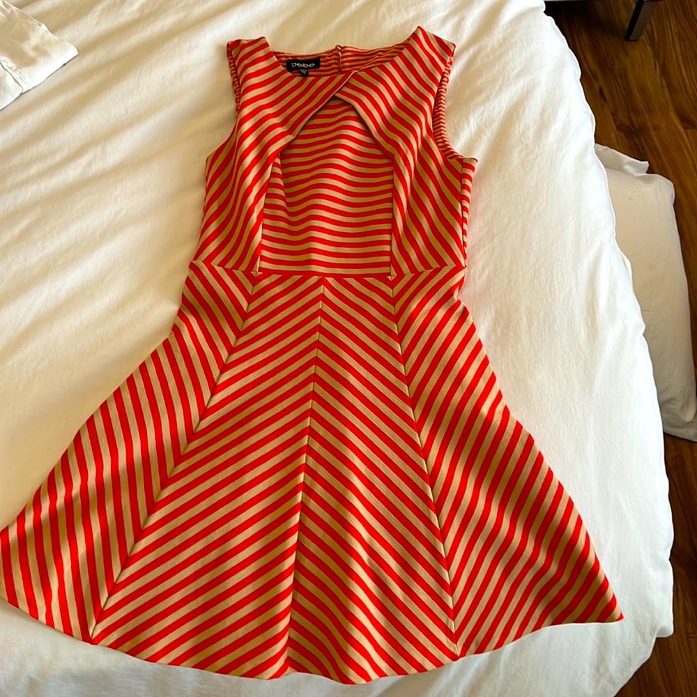 Vintage / never worn orange and tan body sculpting with a poofy skirt Bebe dress